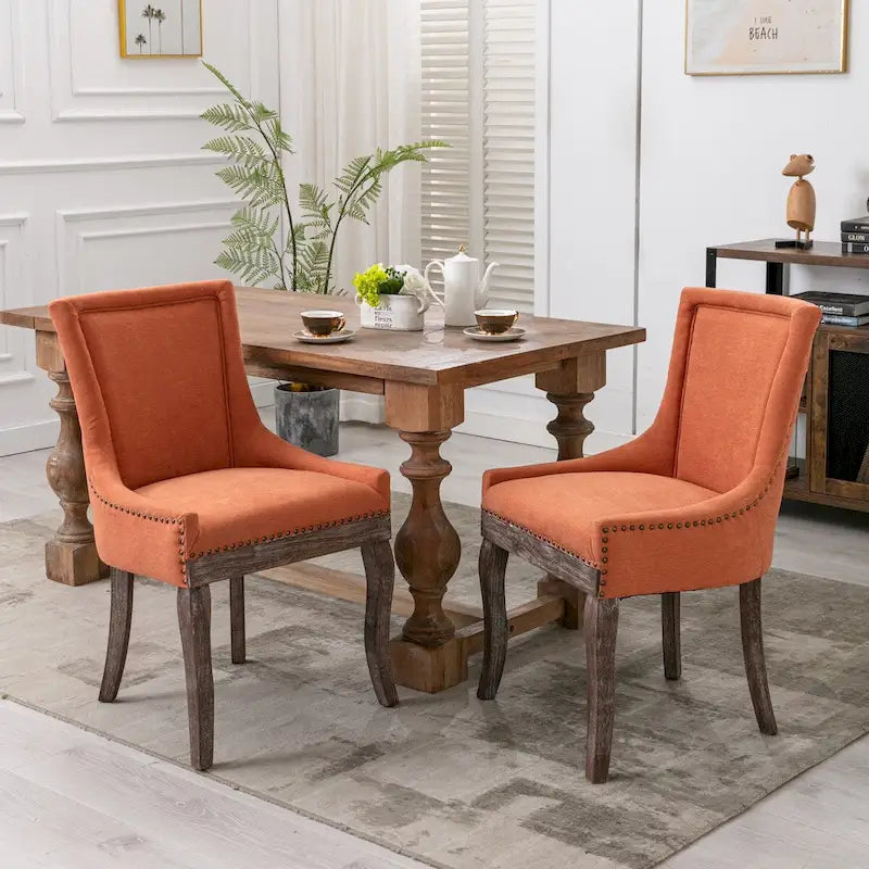 Sedia da pranzo Ultra SideSedie in tessuto ispessito con gambe in legno massello dai toni neutriTesta del chiodo color bronzoSet di 2Blu