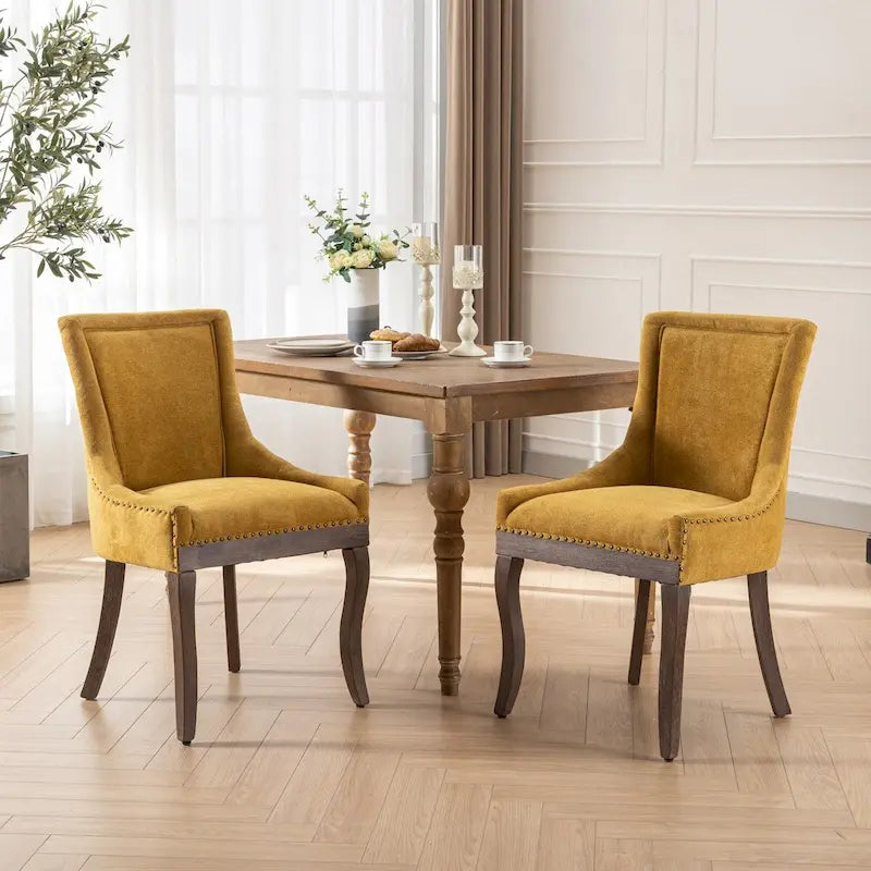 Sedia da pranzo Ultra SideSedie in tessuto ispessito con gambe in legno massello dai toni neutriTesta del chiodo color bronzoSet di 2Blu