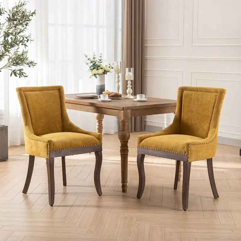 Sedia da pranzo Ultra SideSedie in tessuto ispessito con gambe in legno massello dai toni neutriTesta del chiodo color bronzoSet di 2Blu
